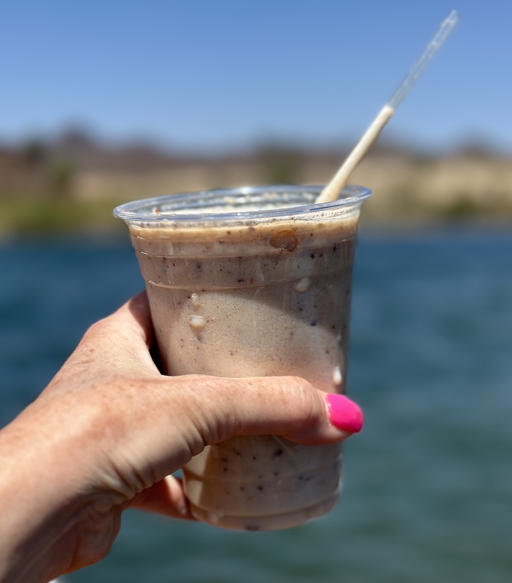Fox's mudslide, a blended drink, with the Colorado River in the background.